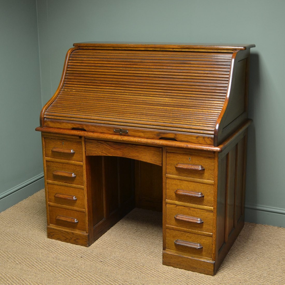 Tall Large Edwardian Oak Antique Roll Top Desk dates from ca. 1900 and is full of beautiful charm and character