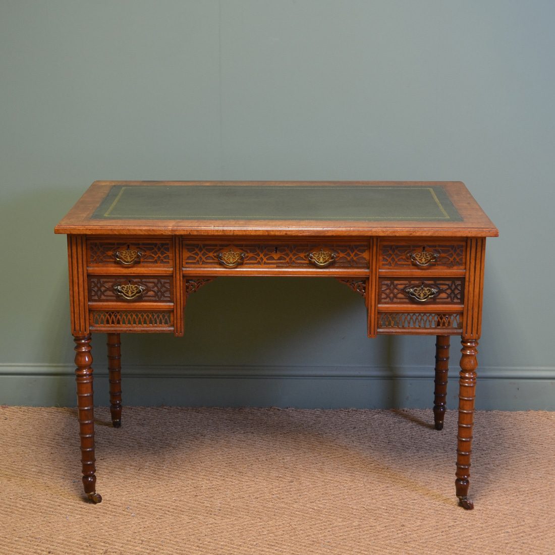 Writing Desk by JAS Shoolbred with decorative blind fretwork carvings